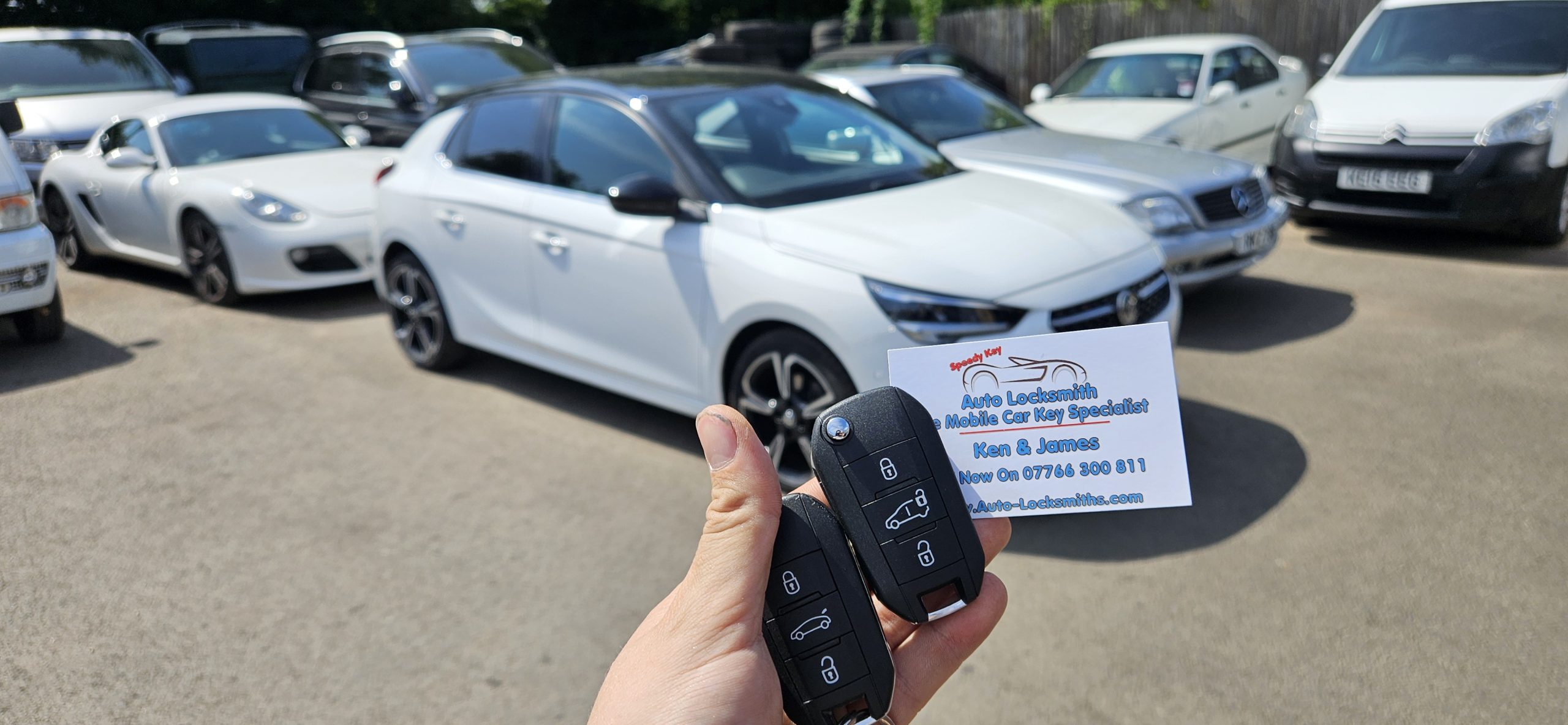 quick car key repair, two keys in hand